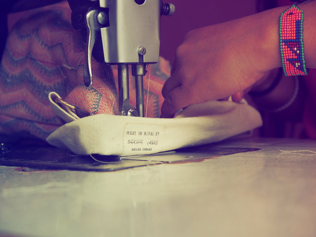 Sewing process a yoga bag out of nepali handwoven dhaka fabric