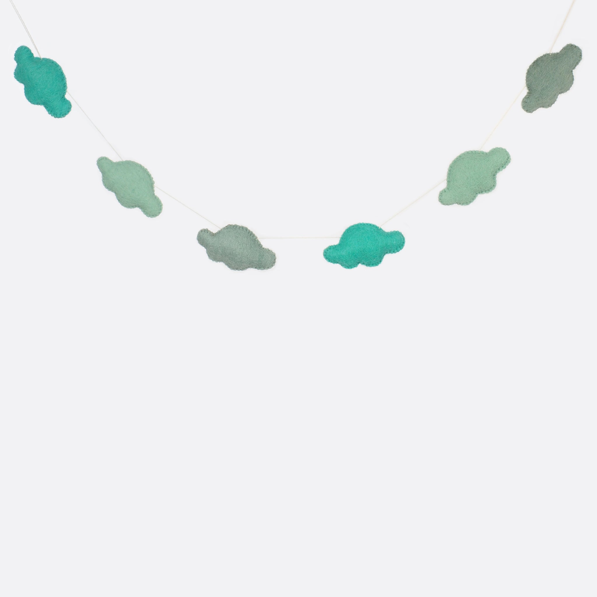 A garland with six small clouds.  Three different shades of blue are used for the clouds.  Two clouds have  always the same blue. 