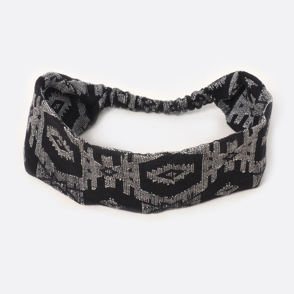 Top view of the Battiayo Black & White headband. The handwoven traditional dhaka fabric is black and white. The dhaka fabric has a geometric pattern and is handwoven by amazing women.