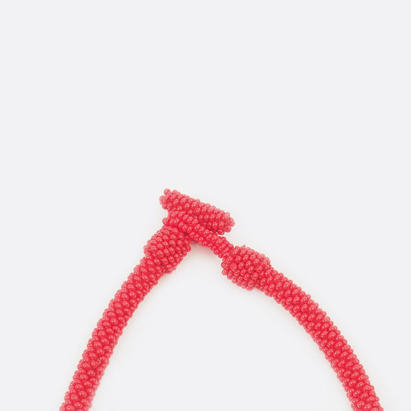 Close up of the handmade Battiayo necklace. 