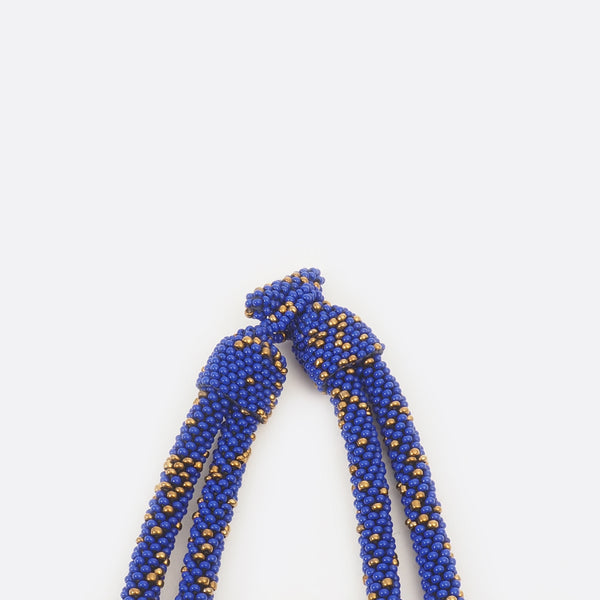 Close up of the necklace clasp. The small glass beads are shown.