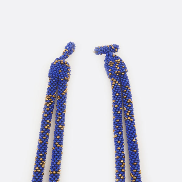 The necklace clasp is open.