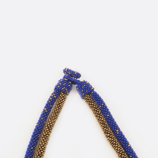 Close up of the necklace clasp. The small glass beads are shown.