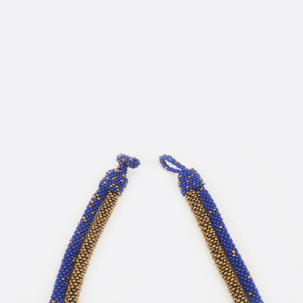 The necklace clasp is open.