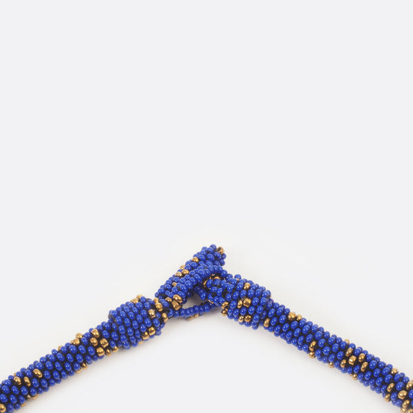 Close up of the necklace clasp. The small glass beads are shown.
