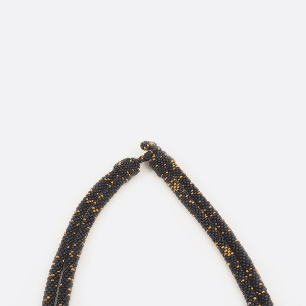 Close up of the necklace clasp. The small glass beads are shown.