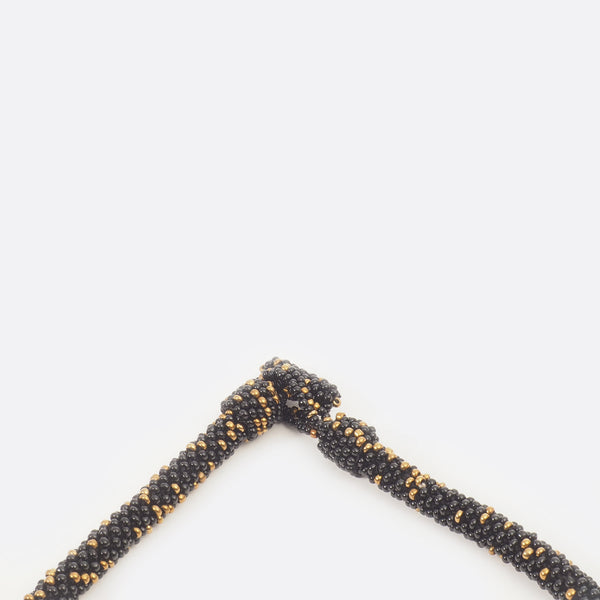 Close up of the necklace clasp. The small glass beads are shown.