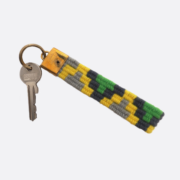 handwoven key chain with handmade brass buckle; key chain is grey, yellow and green