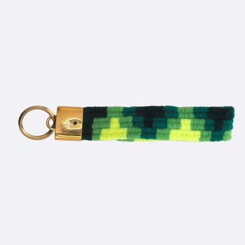 handwoven key chain with handmade brass buckle; key chain has 4 different shades of green