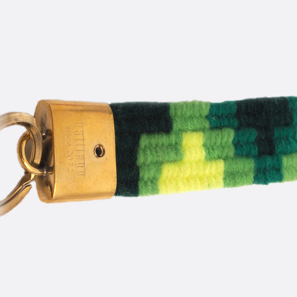 handwoven key chain with handmade brass buckle; key chain has 4 different shades of green