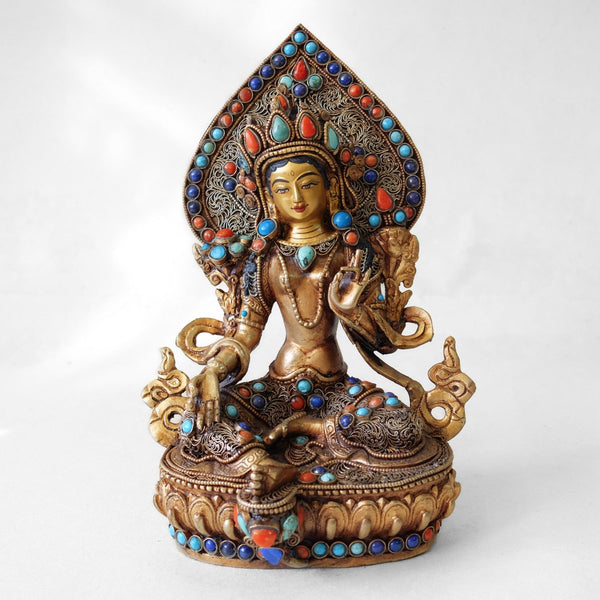 Green Tara statue, body from copper, lost wax casting, decorated with fine filigree, gold and silver plated, set with turquoise, coral and lapis lazuli. The face is set in gold. Handmade in Nepal