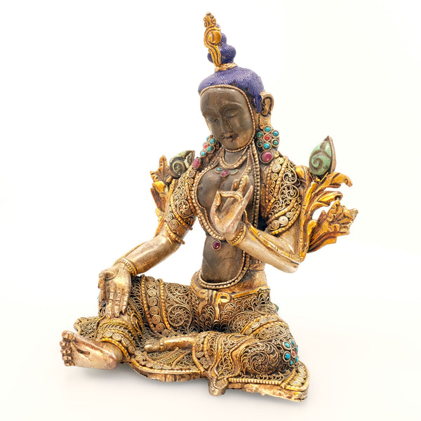 Green Tara, face and body carved from crystal, copper set with filigree, silver plated, gold plated set with turquoise and coral coloured stones. Front view