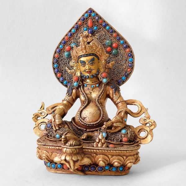 Jambhala statue, body from copper, lost wax casting, decorated with fine filigree, gold and silver plated, set with turquoise, coral and lapis lazuli. The face is set in gold. Handmade in Nepal