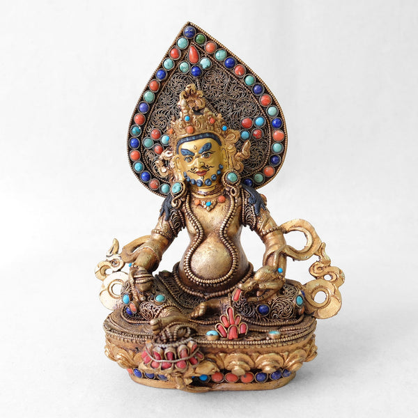 Jambhala statue, body from copper, lost wax casting, decorated with fine filigree, gold and silver plated, set with turquoise, coral and lapis lazuli. The face is set in gold. Made by Shanta Shakya.