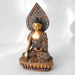 Shankyamuni Buddha statue, body from copper, lost wax casting, decorated with fine filigree, gold and silver plated, set with turquoise and coral. The face is set in gold. Handmade in Nepal