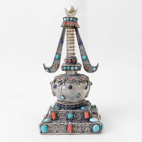Backview. Small stupa made of crystal and copper. Decorated with filigree. Silver plated. Set with coral, lapis lazuli and turquoise.